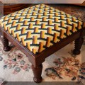 F70. Spiral leg stool with basketweave upholstery.  